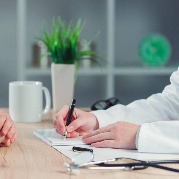 woman-making-appointment-for-medical-exam-at-gener-P5YQGDP